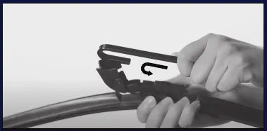 Slide the hook arm through the connector opening
