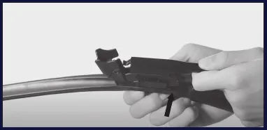 Squeeze the tabs on the connector